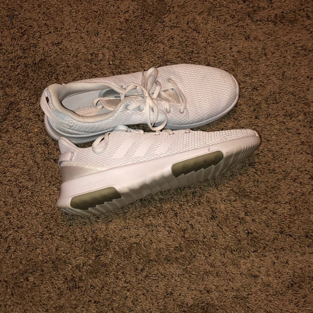 All white adidas running shoes
